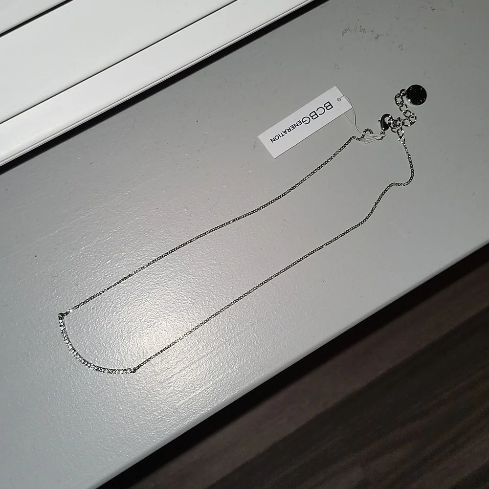 BCBGeneration New, silver tone necklace with rhinestones.
